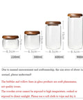 Four Piece Glass Storage Jars With Airtight Wooden Lids Wide Mouth Canister Set for coffee beans, sugar, tea, and pantry use.