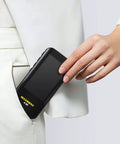 Smart Digital Multimeter With Color LCD Display 6000 Counts tucked into pocket, showcasing portability and design.
