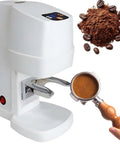 Smart Automatic Espresso Tamper With Auto Fill Dose And Tamp Tech 58mm Precision Gauge, white body, handle with ground coffee.
