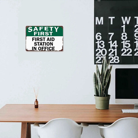 First Aid Station Aluminum Sign 8x12 Inches Dope Wall Decor for Office shown above desk in modern workspace.
