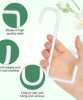 Six Pack 6 Inch Vinyl Fence Hooks White Powder Coated Steel Hangers for indoor outdoor use, hand holding a hook