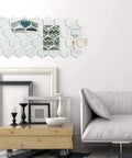 24 Piece Hexagon Acrylic Mirror Wall Decals Set for Living Room above a sofa, showcasing reflective surface and decor upgrade.