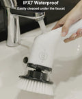 Person cleaning Cordless Electric Spin Scrubber With 8 Replaceable Heads under running faucet, showcasing IPX7 waterproof feature.