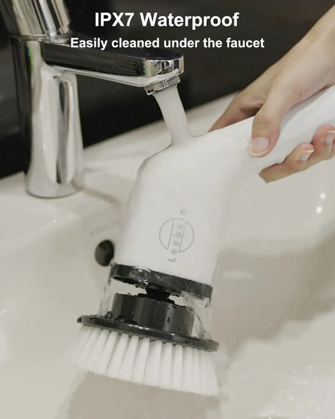Person cleaning Cordless Electric Spin Scrubber With 8 Replaceable Heads under running faucet, showcasing IPX7 waterproof feature.