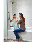 Woman assisting child in bathtub with 3-Pack 24 Inch Heavy-Duty Shower Grab Bar ADA Compliant Satin Nickel 450 Lb Capacity Bathroom Safety Handle