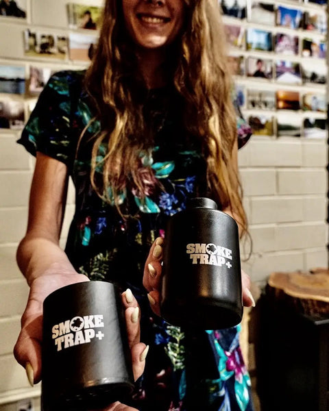 Person holding Replaceable Filter Cartridges For Smoke Trap Set With Four Stage HEPA And Activated Coconut Carbon