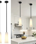 Ziikopoo 2 Pack Modern Matte Black Kitchen Island Pendant Lights, Conical Ribbed Glass Shade above a kitchen island.