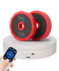 Smooth Spinning 360 Degree Electrical Turntable With Killer Remote Control For Pro Photography And 3D Modeling, Hella Precise Speed And Angle Adjustment, Continuous Step And Swing Modes For Studio Gear Or Retail Display Setup with two red and black 5kg weights.