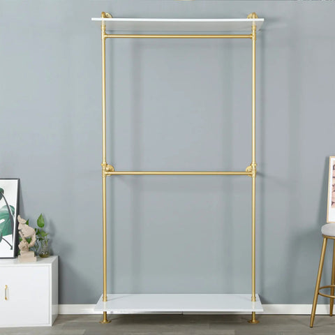 Hella Sturdy Two Tier Industrial Garment Rack With Thick Wood Shelf And Durable Metal Frame Wall Mounted Double Hanging Rods Clothes Storage Shelf For Home Or Boutique, featuring gold pipes and a white shelf.