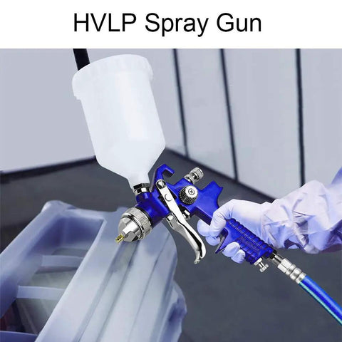 Person using HVLP Gravity Feed Spray Gun Set With Locking Regulator Gauge, Dual Head Nozzles 0.8mm 150ml And 1.4mm 600ml