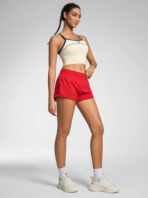 Model wearing Womens Quick Dry Running Shorts 2.5 Inch Inseam With High Waisted Zip Pockets Lightweight Gym Shorts Built In Liner Red XS