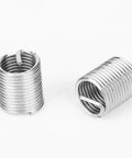 Close-up of stainless steel inserts from the M10 X 1.25 Internal Thread Repair Kit with 12 Inserts for auto and machinery maintenance.