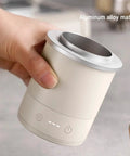 Hand holding the Total Game Changer Aluminum Coffee Dosing Cup And Espresso Digital Scale Combo, showcasing aluminum material and design.
