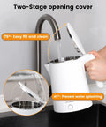 Electric Kettle Stainless Steel 1 Liter 1200W Quick Boil With Double Wall Cool Touch Design Auto Shut Off BPA Free 304 Stainless Steel Water Boiler For Coffee Tea Maker Warmer Heater White being filled from a faucet with angled lid.