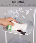 Cleaning the Rock Solid 10 Tier Metal Shoe Rack With Coat Hooks, showcasing easy maintenance and surface care.