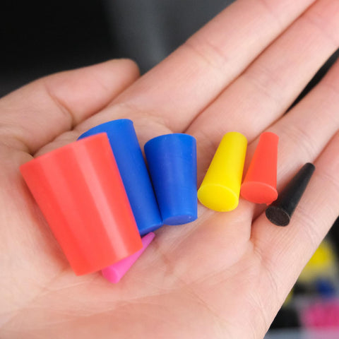 Color-coded silicone tapered plugs from 40 Piece High Temp Silicone Rubber Stoppers Set With 8 Sizes Tapered Plugs Color Coded For Masking
