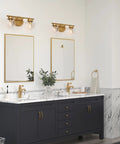 Bathroom with Two-Light Gold Vanity Light With Clear Globe Glass Shades Over-Mirror Fixture In Hand-Painted Gold Finish