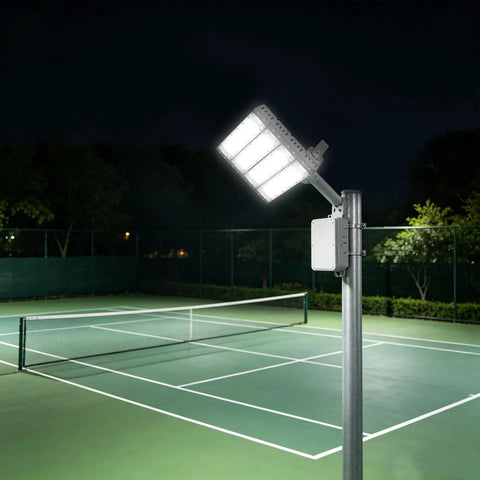 Stadium Flood Light 200W IP67 Water-Resistant 180° Adjustable Bracket on a pole illuminating a tennis court at night.