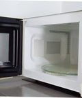 Open microwave showing installed mica sheet, part of 10 Piece Mica Insulation Sheets For Microwave Ovens, Heat Resistant Waveguide Covers set