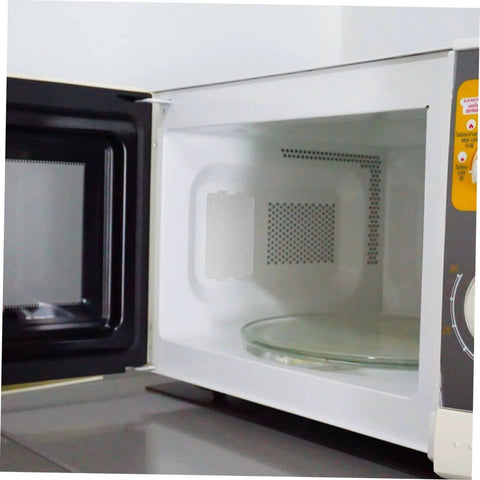 Open microwave showing installed mica sheet, part of 10 Piece Mica Insulation Sheets For Microwave Ovens, Heat Resistant Waveguide Covers set