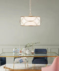 Gold Drum Pendant Chandelier Light Fixture With White Fabric Shade, 4 Light Modern Chandelier over glass dining table