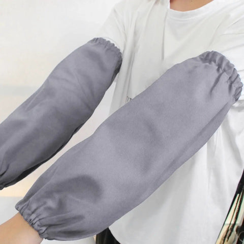 Heavy Duty Welding Arm Protectors With Flame Retardant Gray Sleeve Guards shown worn, providing comfortable forearm shielding during welding tasks.