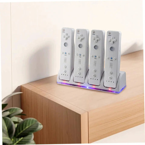 4 In 1 Battery Charging Station for Game Controllers on tabletop, charging four gaming remotes with LED indicators, USB cable visible