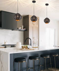 Industrial Vintage Pendant Light With Diamond Geometric Shade In Matte Black Metal hanging over kitchen island.