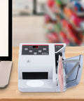 Money Counter Machine With UV MG WM Counterfeit Detection, Portable Cash Counter For Businesses On The Go on desk.