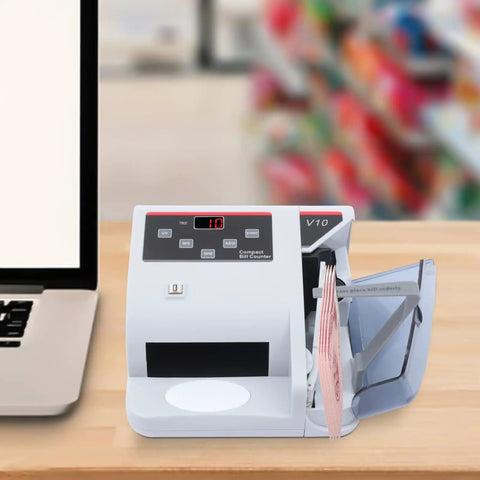 Money Counter Machine With UV MG WM Counterfeit Detection, Portable Cash Counter For Businesses On The Go on desk.