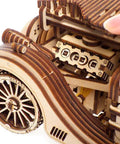 Roadster 3D Wooden Car Kit For Adults, DIY Mechanical Model With Transmission, Plywood Build, Real Working Gear System, Hands-On STEM Toy, Perfect Gift For Car Enthusiasts And Builders, Vintage Style Craft Project close-up of wooden wheel and gearbox
