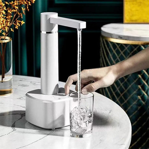 Desktop Water Dispenser With Hot And Cold Water, Three Level Volume Control, USB Charging, on table dispensing water into a glass