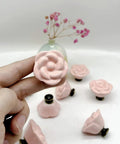 Grab This Dope 10 Piece Set Of Pink Rose Porcelain Cabinet Knobs Perfect For Dressing Up Drawers And Dressers. 1.4 Inch Ceramic flower handle held in hand.