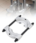 Heavy-duty bearing puller tool with two silver clamp jaws and black rods for wheel hub and pulley removal