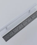 Two Pack Stick On Cabinet Handles Seven Point Eight Inch White No Drill Installation With Ultra Strong Adhesive Tape next to ruler