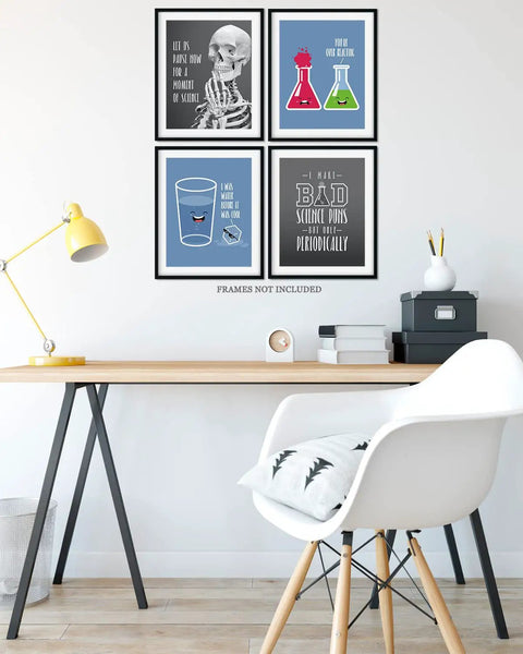 Science Pun Room Decor Set Of 4 Nerdy Lab Wall Art Prints 8x10 Unframed on wall above desk with chair and lamp.