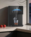 Wall Mounted Office Water Cooler With Instant Hot Water Dispenser On Demand in modern kitchen with steaming cup underneath