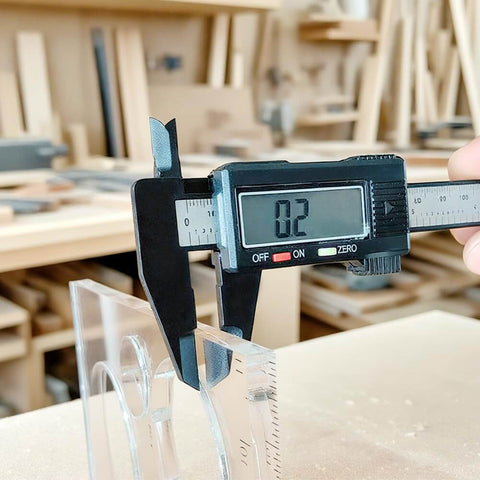Two Piece 15 In One Acrylic Router Templates For Woodworking With Heart Inlay Template And Circle Template Jig Drawing Cut Guide Pro Grade Inlay Tools And Accessories Set For DIY Wood Projects shown with caliper measuring 0.2 inch thickness in workshop setting.