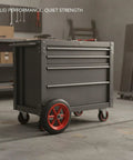 Heavy Duty Solid Rubber Plate Caster Wheel 11.02 Inch Diameter on an industrial tool cart in workshop