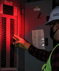 Person using Rechargeable Two Color LED Headlamp with Durable Fabric Strap in red mode, examining electrical panel.