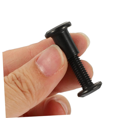 Kickass Black Stainless Steel M6 X25 Chicago Screw held between fingers, perfect for leather crafting and bookbinding needs.