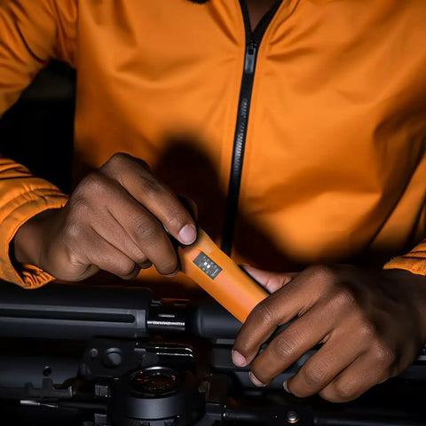 Close-up of hands using Torque Screwdriver And Driver Set For Maintenance And Bike Repair Ten To Seventy Inch Pounds Range T Bar Handle Forty Bits Including Phillips Pozidriv Slotted Hex Torx One Quarter Inch Socket Shaft Extension Orange with bike equipment.