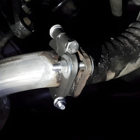 Heavy Duty Carbon Steel Exhaust Split Flange Repair Kit 2 Inch Rustproof Oval Connector installed on exhaust pipe with bolts.