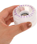 Hand holding transparent 2 Pack LED Light Up Roller Skate Replacement Wheel, 58mm size, showing PU material and purple markings