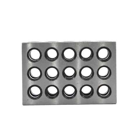 Rectangular machinist block with 15 round holes on a steel gray plate for milling setups