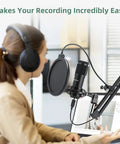 Woman using Pro Grade USB Condenser Podcast Microphone Kit With 192KHz 24Bit Audio for Recording Streaming Gaming Voiceover YouTube and Twitch Ready To Rock And Roll, with shock mount and table clamp.