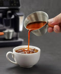 Pouring coffee from Barista-Grade Stainless Steel Espresso Shot Cup With Handle, V-Shaped Spouts Measuring Cup, 3.4 oz 100 ml