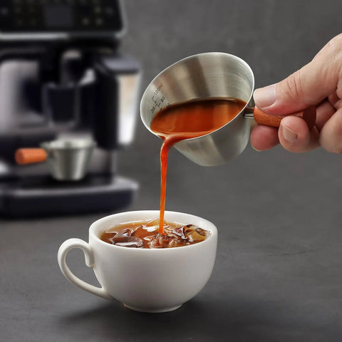 Pouring coffee from Barista-Grade Stainless Steel Espresso Shot Cup With Handle, V-Shaped Spouts Measuring Cup, 3.4 oz 100 ml