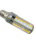 Close-up of a clear LED bulb with visible yellow diodes, featuring a spiral metal base for efficient light emission.