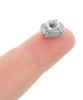 Solid Hammer Head M3 And M5 T Slot Nuts Made From Tough Carbon Steel, showing a metallic T nut on a fingertip for scale.